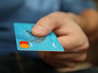 Man extending credit card