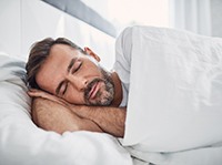 Man sleeping in bed