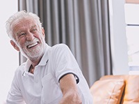 Man with dentures laughing