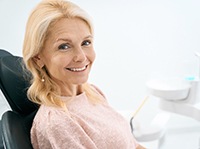 Woman smiling in the dental chair