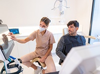 Patient in Belchertown talking to dentist about dental emergencies 