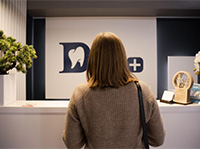 Woman checking in at dentist