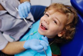 A smiling child in the dental chair