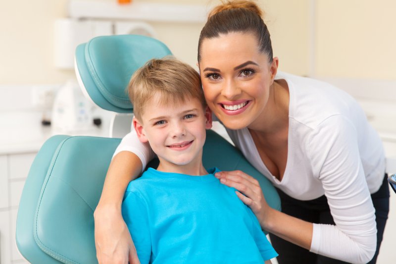 mother and child smiling at dentist