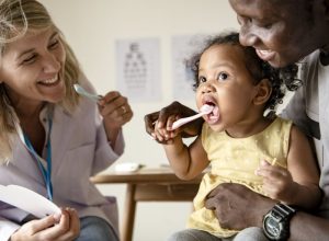 mother at her child’s first dental visit 