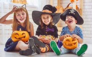 Young children in Halloween costumes