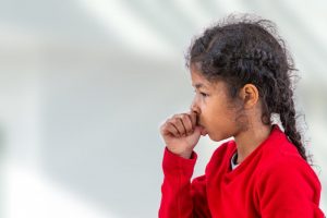 little girl sucking her thumb