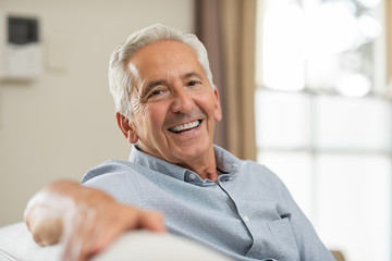 person with dentures smiling