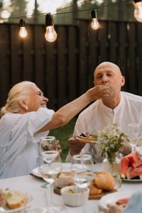 Older couple eating outdoors