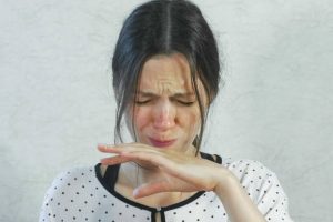 Woman tasting something unpleasant